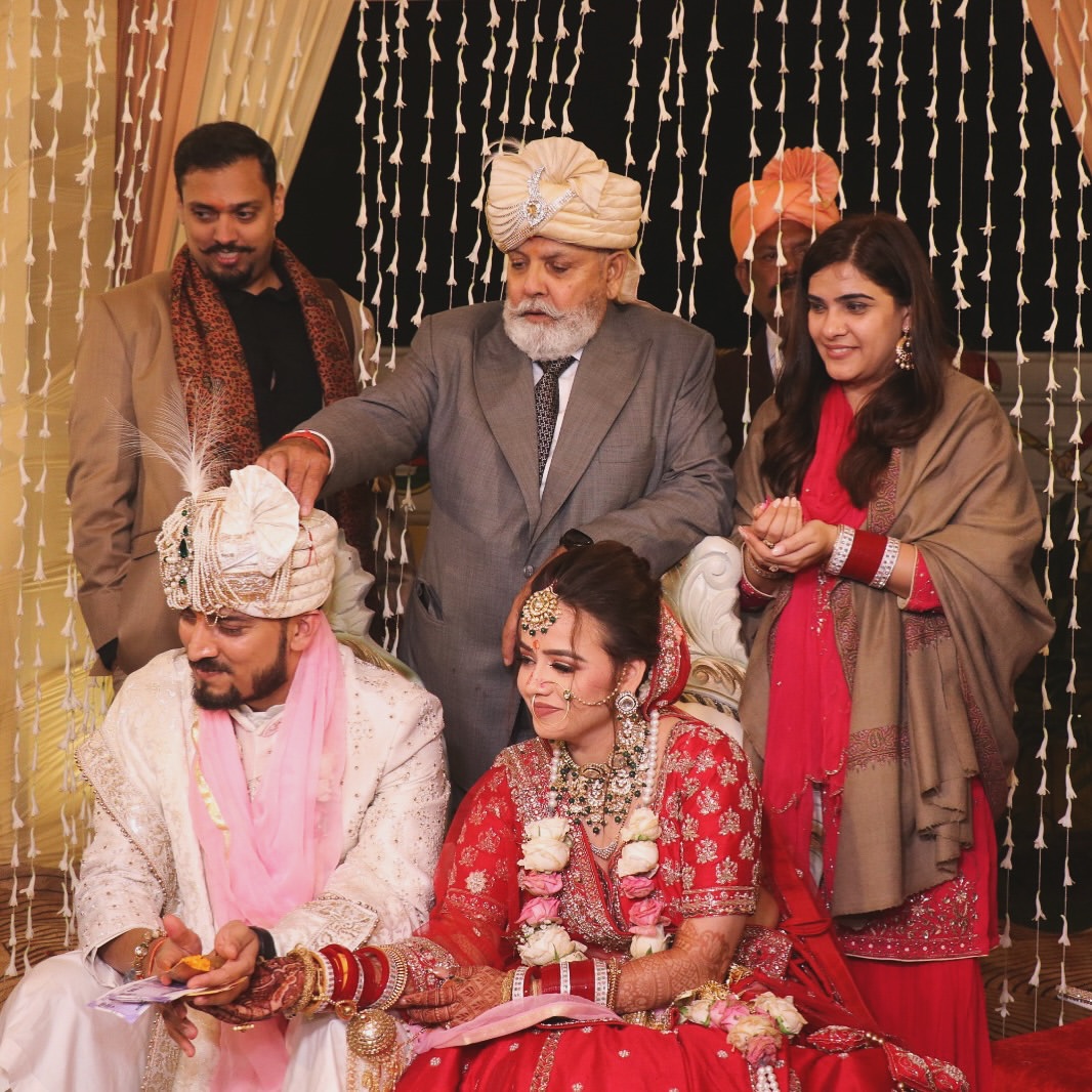 Family blessing the newly married couple during the wedding ceremony